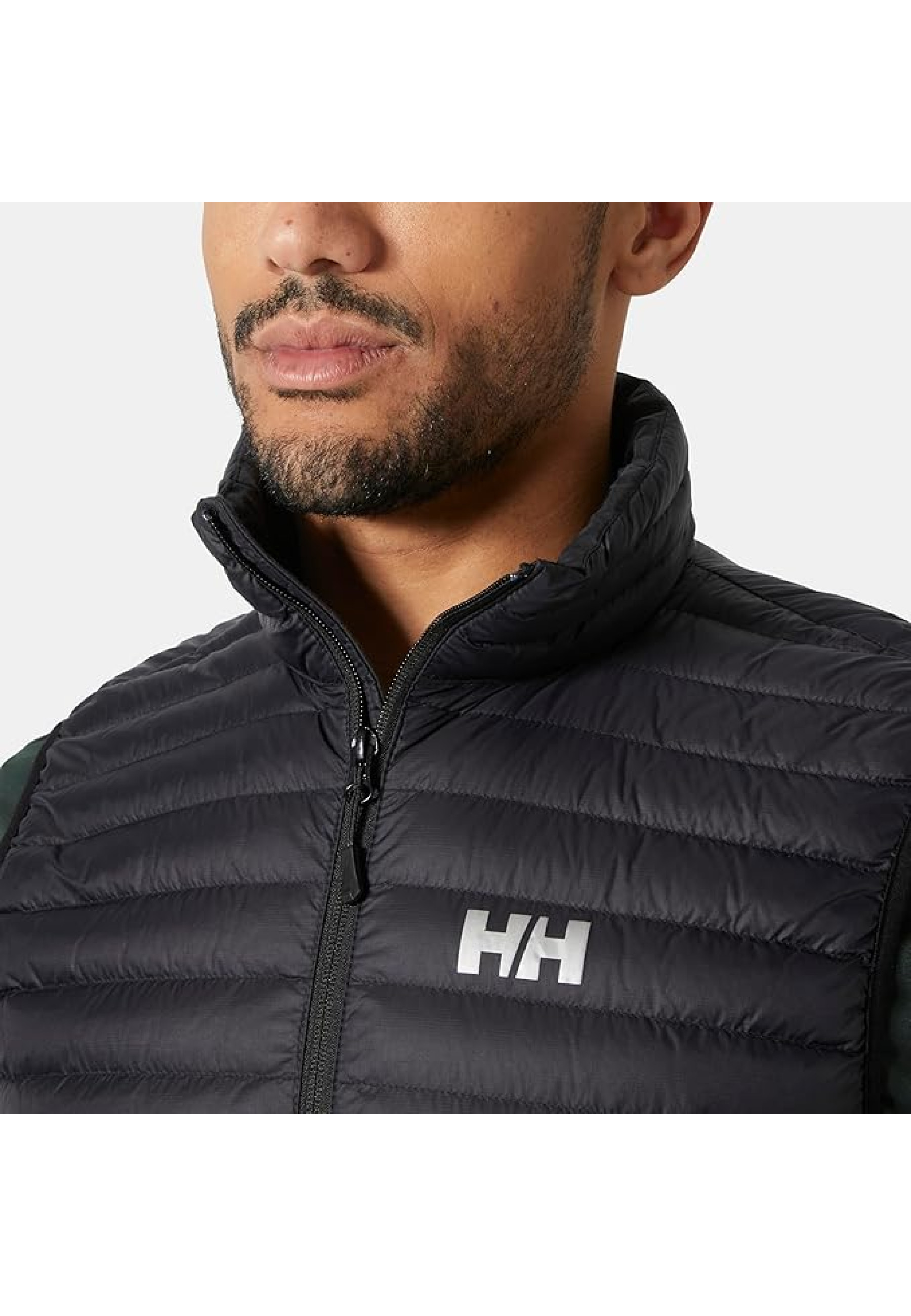 Outfit with Helly Hansen Sirdal Insulated Vest Black and jacket for outdoor style 2026