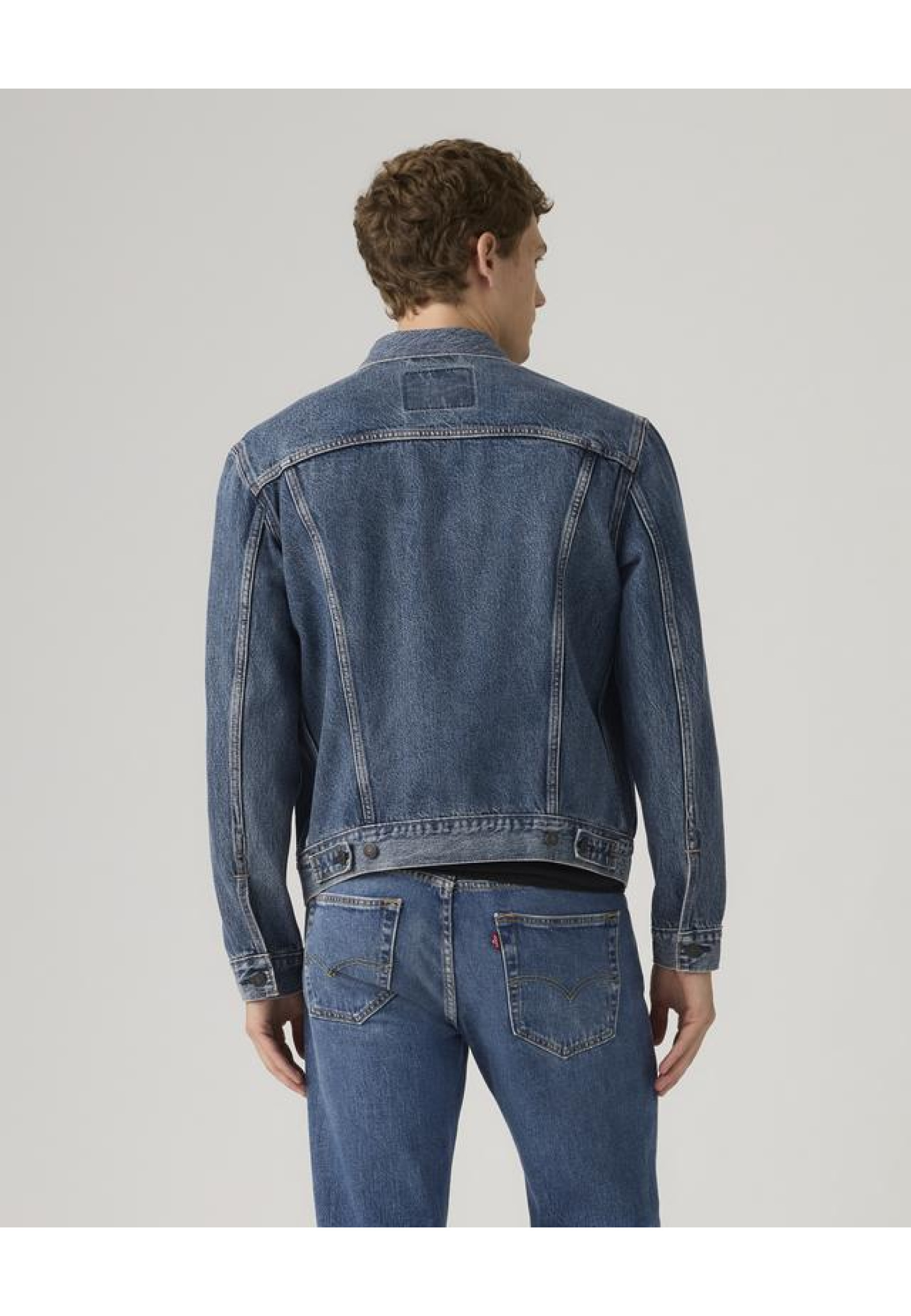 Men's Levi's Trucker Jacket Lombard Nights Dark Wash Style #723340795 in a city look with jeans