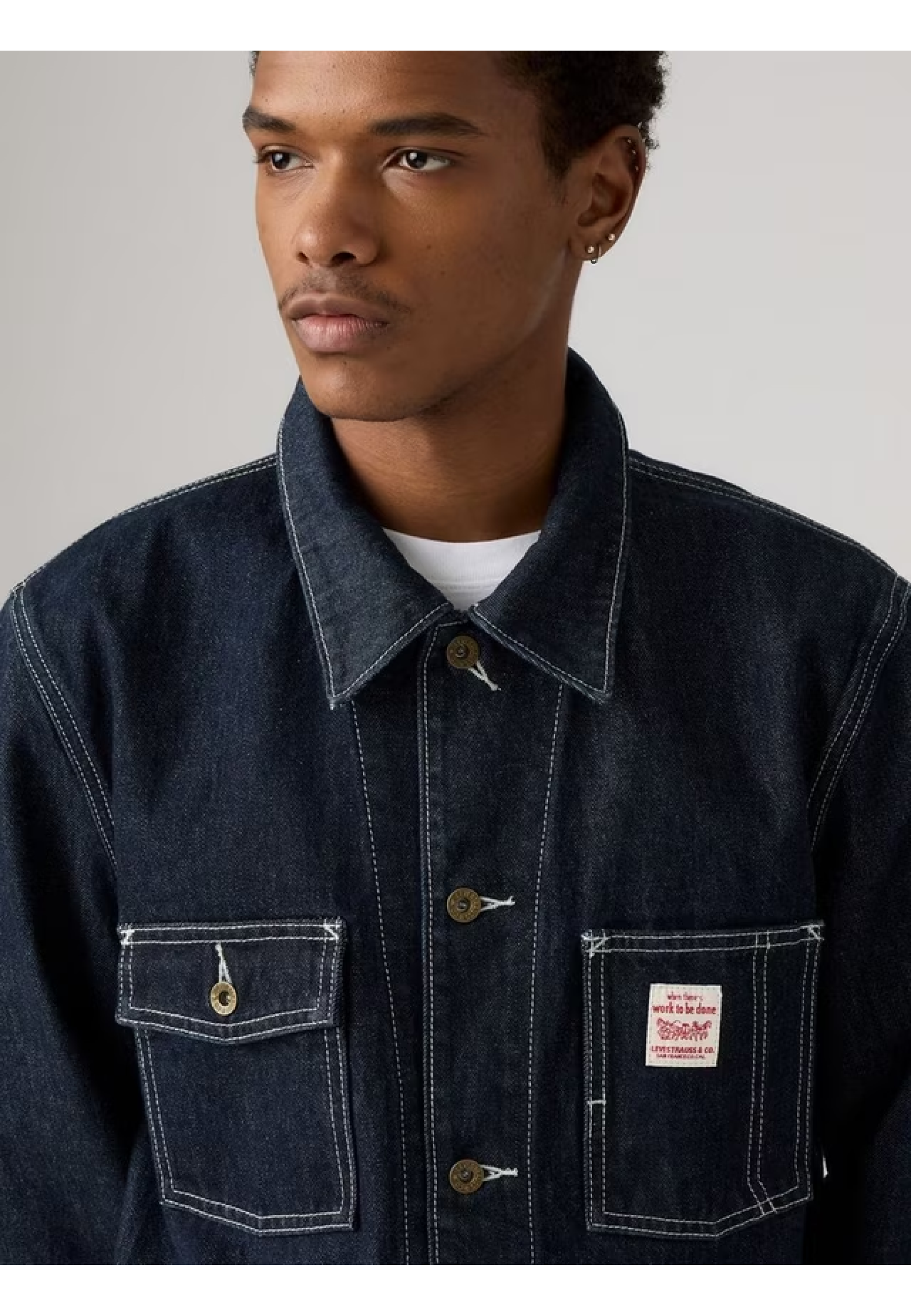 Man wearing Levi's Berkley Chore Coat Dark Wash with jeans and boots