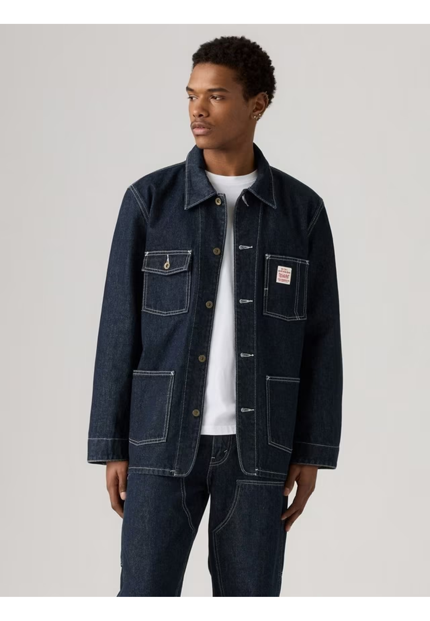 Man wearing Levi's Berkley Chore Coat Dark Wash with jeans and boots
