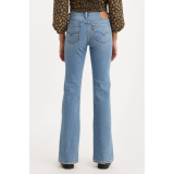 Жіночі джинси Levi's Superlow Bootcut Medium Wash у повсякденному образі з чоботами