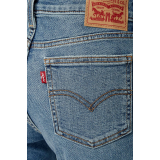 Жіночі джинси Levi's Superlow Bootcut Medium Wash у повсякденному образі з чоботами